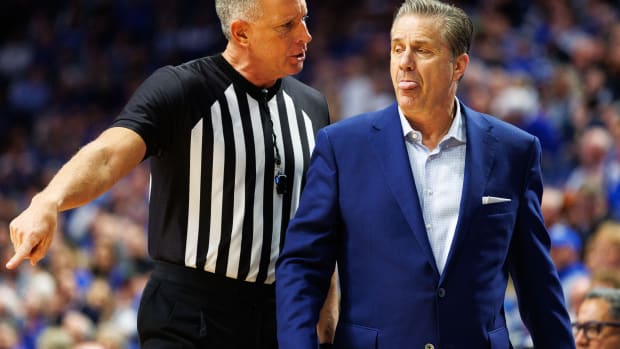Jan 31, 2024; Lexington, Kentucky, USA; Referee Don Daily speaks with Kentucky Wildcats head coach John Calipari during the second half between the Kentucky Wildcats and the Florida Gators at Rupp Arena at Central Bank Center. Mandatory Credit: Jordan Prather-USA TODAY Sports